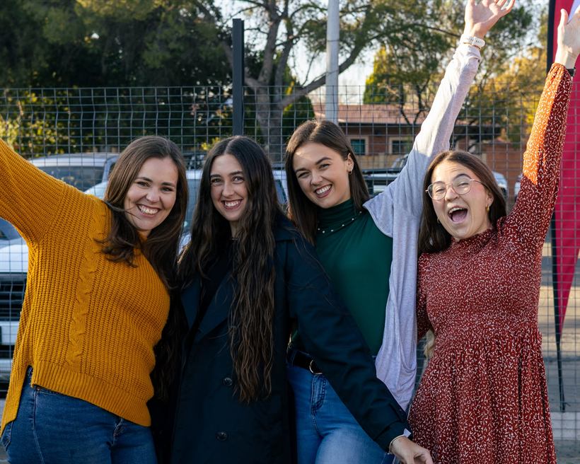 Friends laughing together outside church