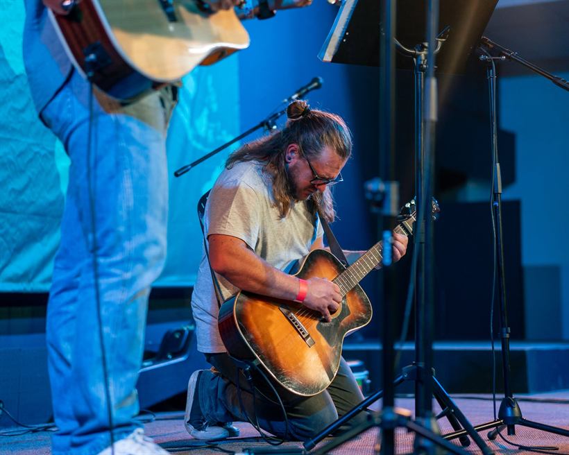 Leading worship on guitar